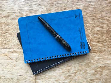 notebooks and pen